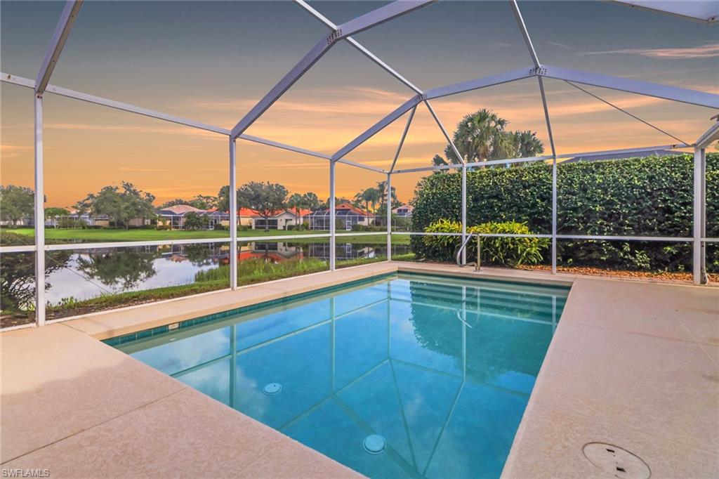 3751 Exuma Way Naples, FL 34119 - Photo 26 of 33 a view of a green field with sitting area