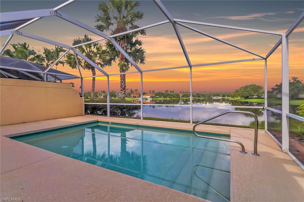3751 Exuma Way Naples, FL 34119 - Photo 28 of 33 a view of a backyard with a swimming pool