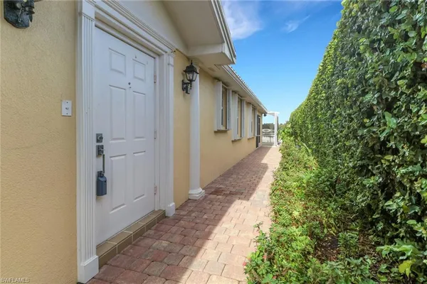 a view of a pathway besides a house