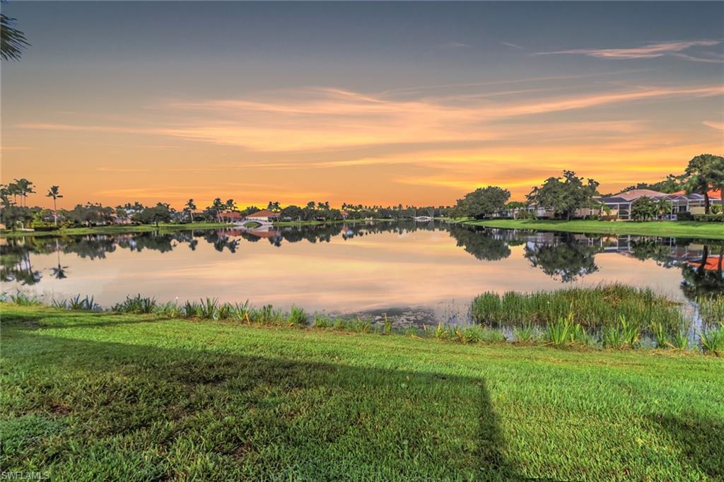 3751 Exuma Way Naples, FL 34119 - Photo 31 of 33 a view of a lake with houses in the back