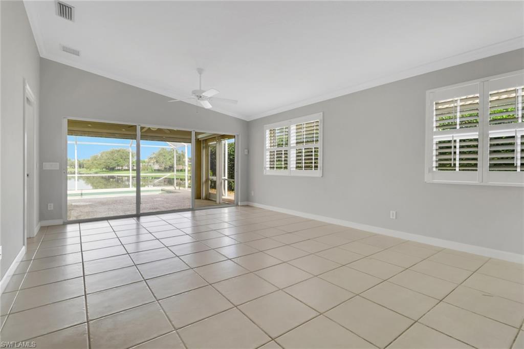 3751 Exuma Way Naples, FL 34119 - Photo 7 of 33 a view of an empty room with a window