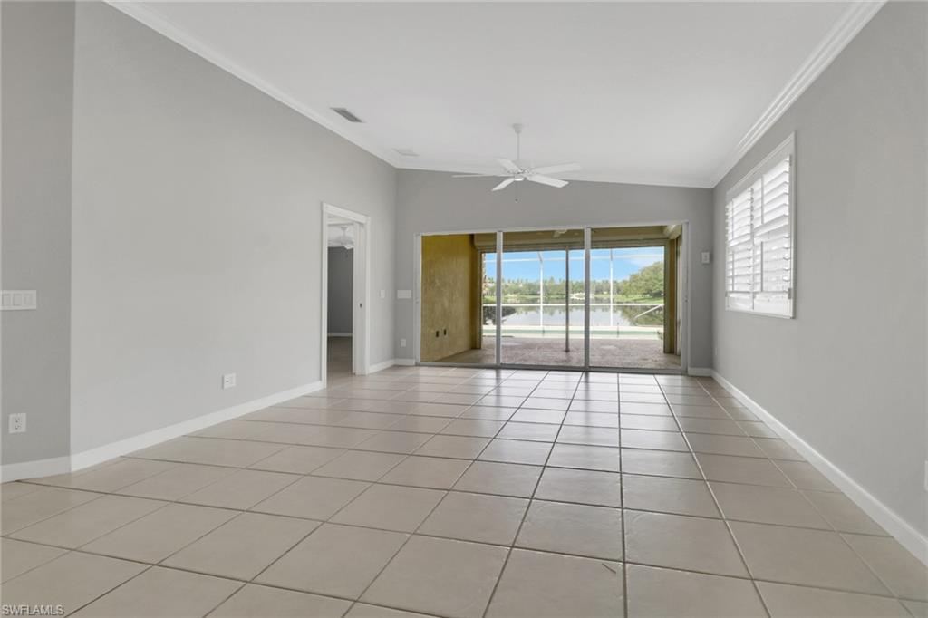 3751 Exuma Way Naples, FL 34119 - Photo 8 of 33 a view of an empty room with a window