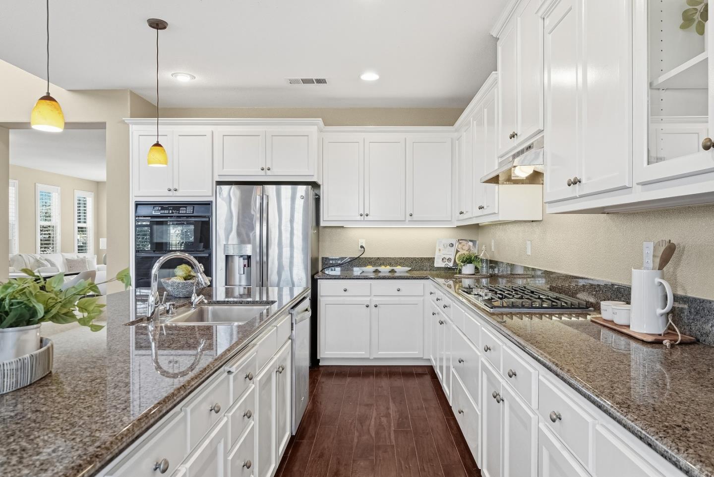 806 Mornington Court San Ramon, CA 94582 - Photo 15 of 58 a kitchen with kitchen island granite countertop a sink a counter space appliances and cabinets