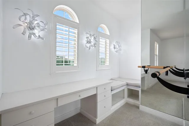 a view of a backyard with sitting area