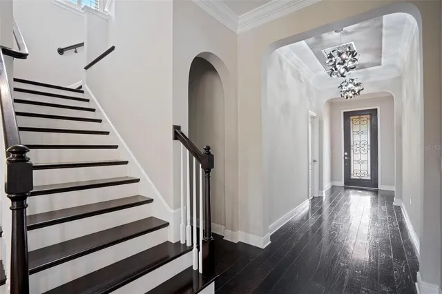 a kitchen with stainless steel appliances a sink and a refrigerator