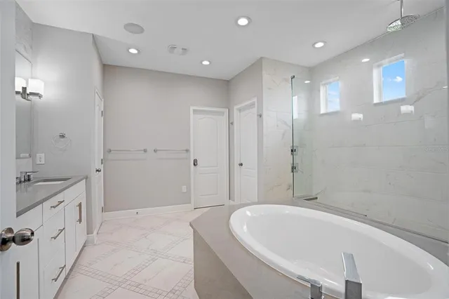 a view of a patio with table and chairs under an umbrella