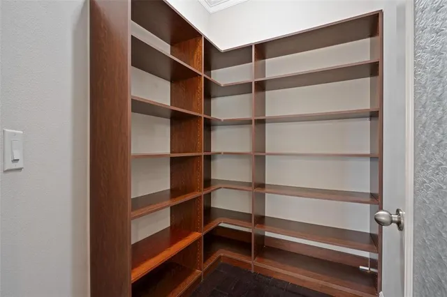 an aerial view of a house with a garden and lake view