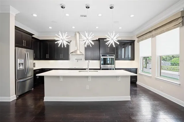 a view of a kitchen with furniture and wooden floor