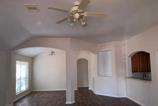 a view of a hallway with entryway and chandelier