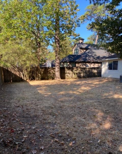 12307 Longfellow Drive Montgomery, TX 77356 - Photo 22 of 23 a view of a house with a yard