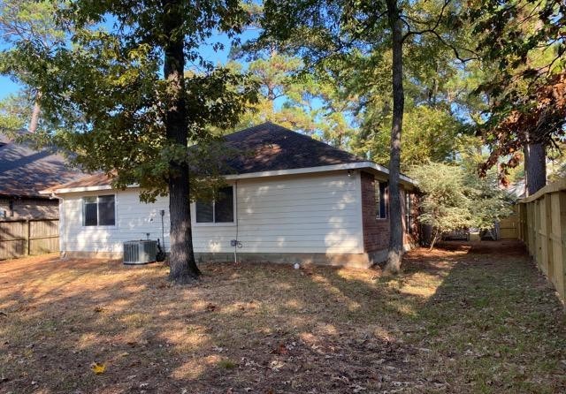 12307 Longfellow Drive Montgomery, TX 77356 - Photo 23 of 23 a front view of a house with a yard and garage