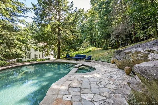 a view of a backyard with water fountain