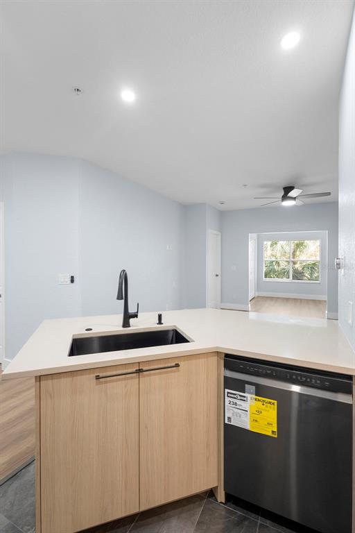 822 Camargo Way, Unit 307 Altamonte Springs, FL 32714 - Photo 11 of 46 a kitchen with stainless steel appliances a sink and cabinets