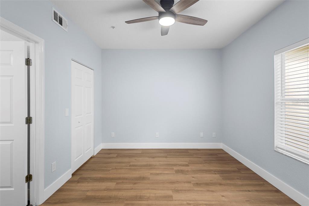 822 Camargo Way, Unit 307 Altamonte Springs, FL 32714 - Photo 19 of 46 wooden floor in an empty room with a window