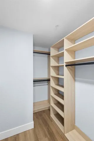 a view of an empty walk in closet