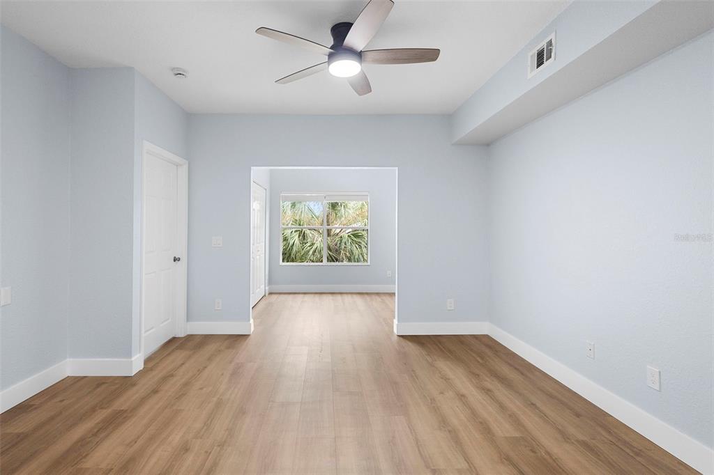 822 Camargo Way, Unit 307 Altamonte Springs, FL 32714 - Photo 22 of 46 wooden floor in an empty room with a window