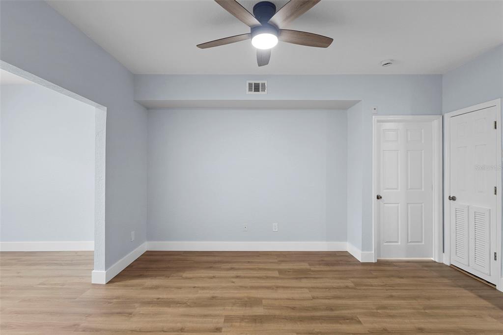 822 Camargo Way, Unit 307 Altamonte Springs, FL 32714 - Photo 27 of 46 a view of an empty room with wooden floor
