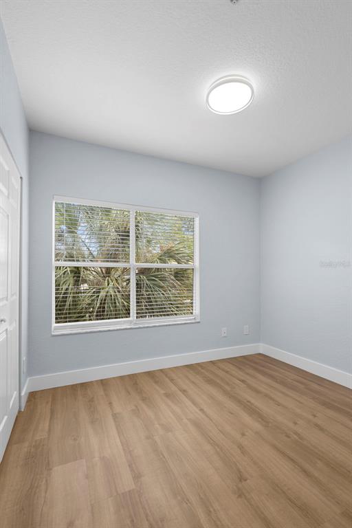822 Camargo Way, Unit 307 Altamonte Springs, FL 32714 - Photo 29 of 46 wooden floor in an empty room with a window