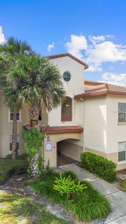 822 Camargo Way, Unit 307 Altamonte Springs, FL 32714 - Photo 3 of 46 a front view of a house with a garden