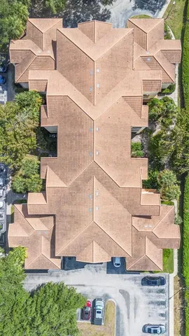 an aerial view of a house with outdoor space
