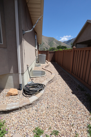 1055 North 1000 East Mapleton, UT 84664 - Photo 94 of 112 Pebble landscaping with a stone block retaining wall