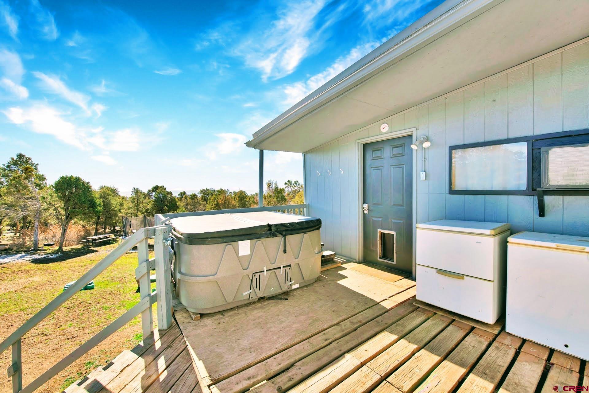 20984 Upland Road Cedaredge, CO 81413 - Photo 11 of 34 a spacious bathroom with a tub and shower