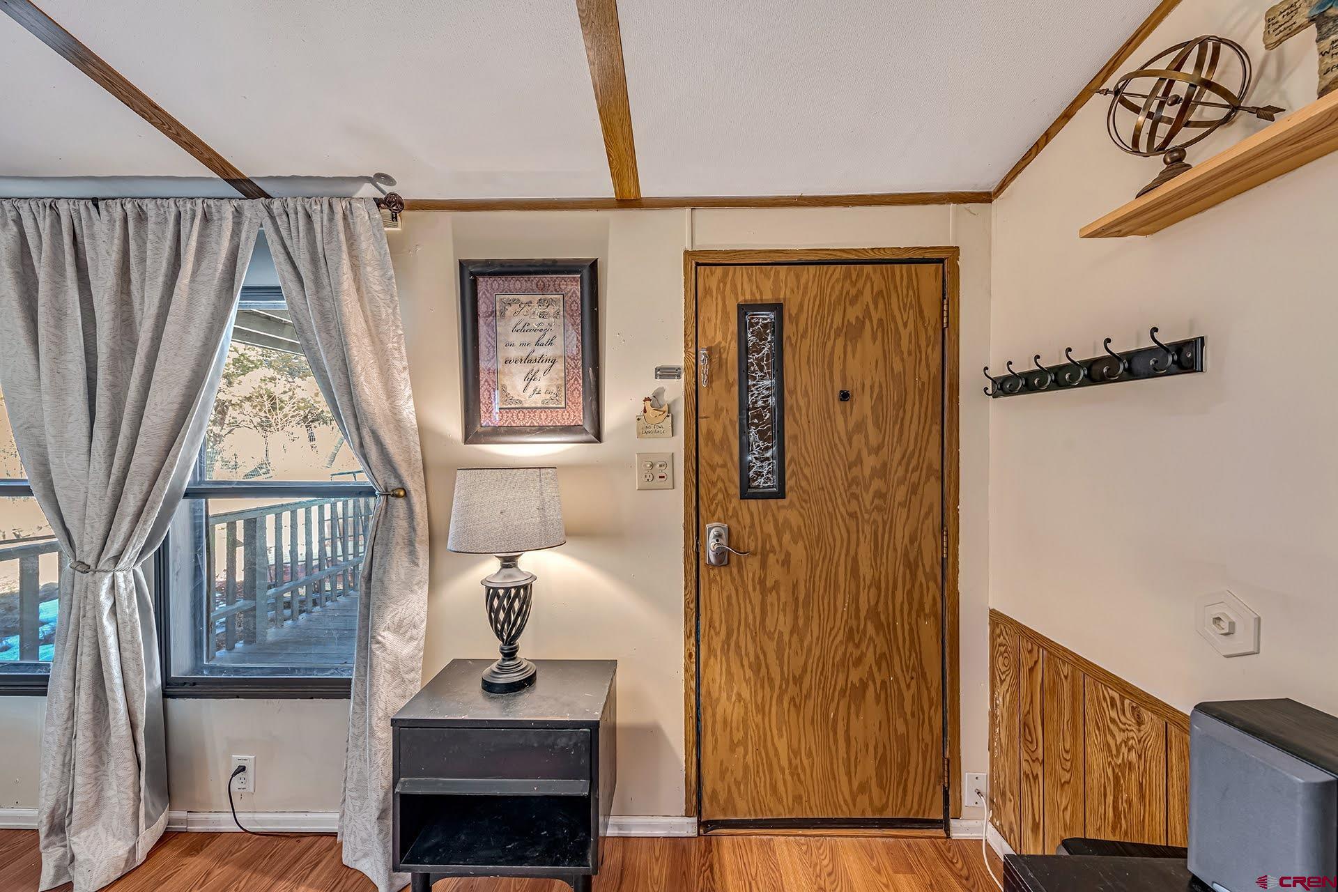20984 Upland Road Cedaredge, CO 81413 - Photo 13 of 34 a bedroom with furniture and a window