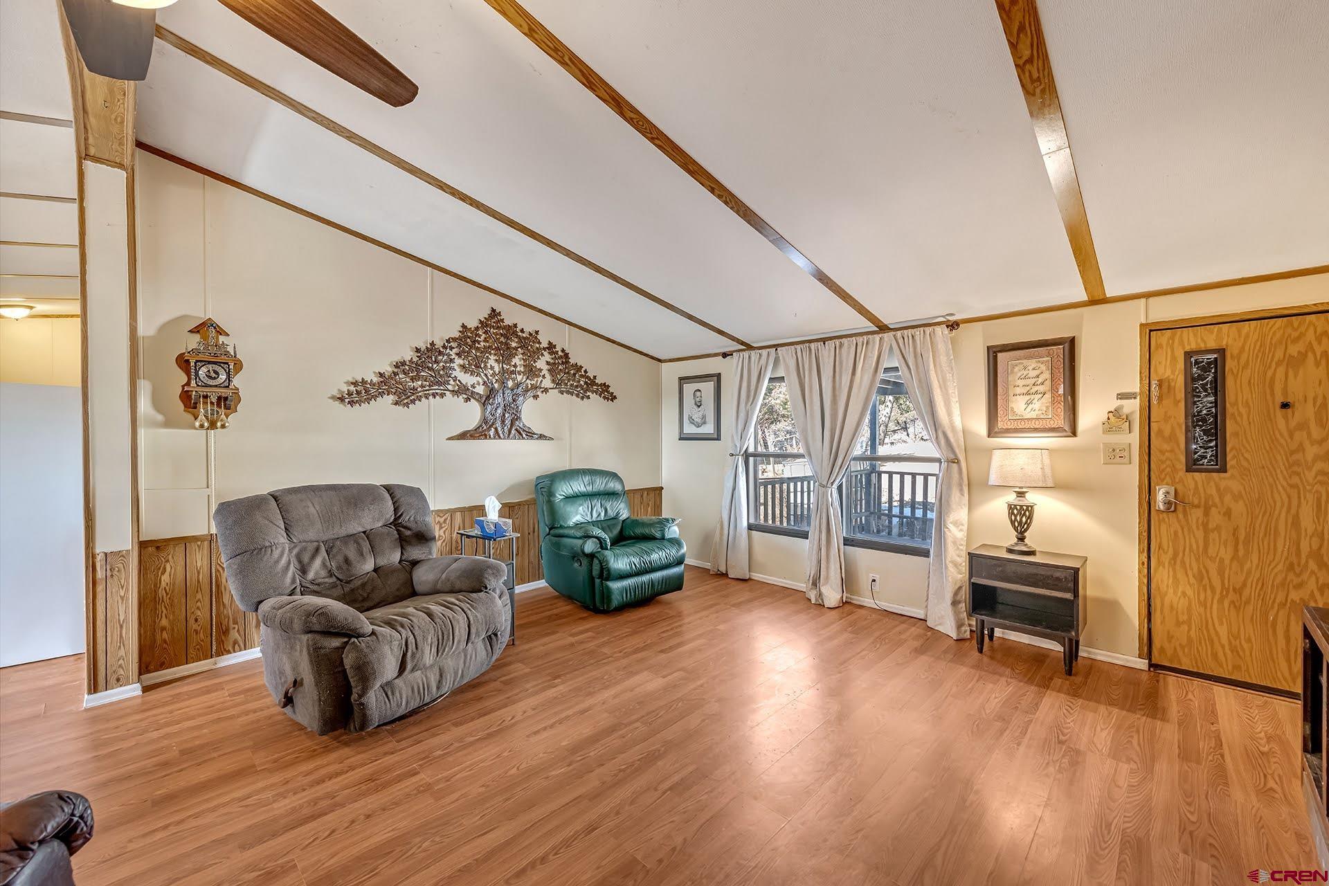 20984 Upland Road Cedaredge, CO 81413 - Photo 17 of 34 a living room with furniture and wooden floor