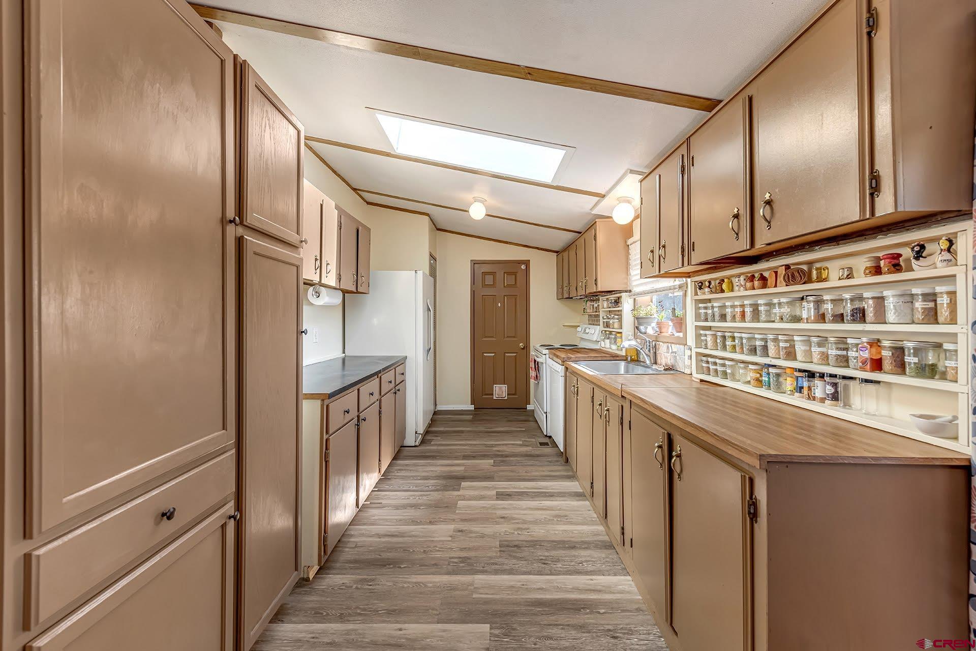 20984 Upland Road Cedaredge, CO 81413 - Photo 21 of 34 a view of a kitchen with car parked