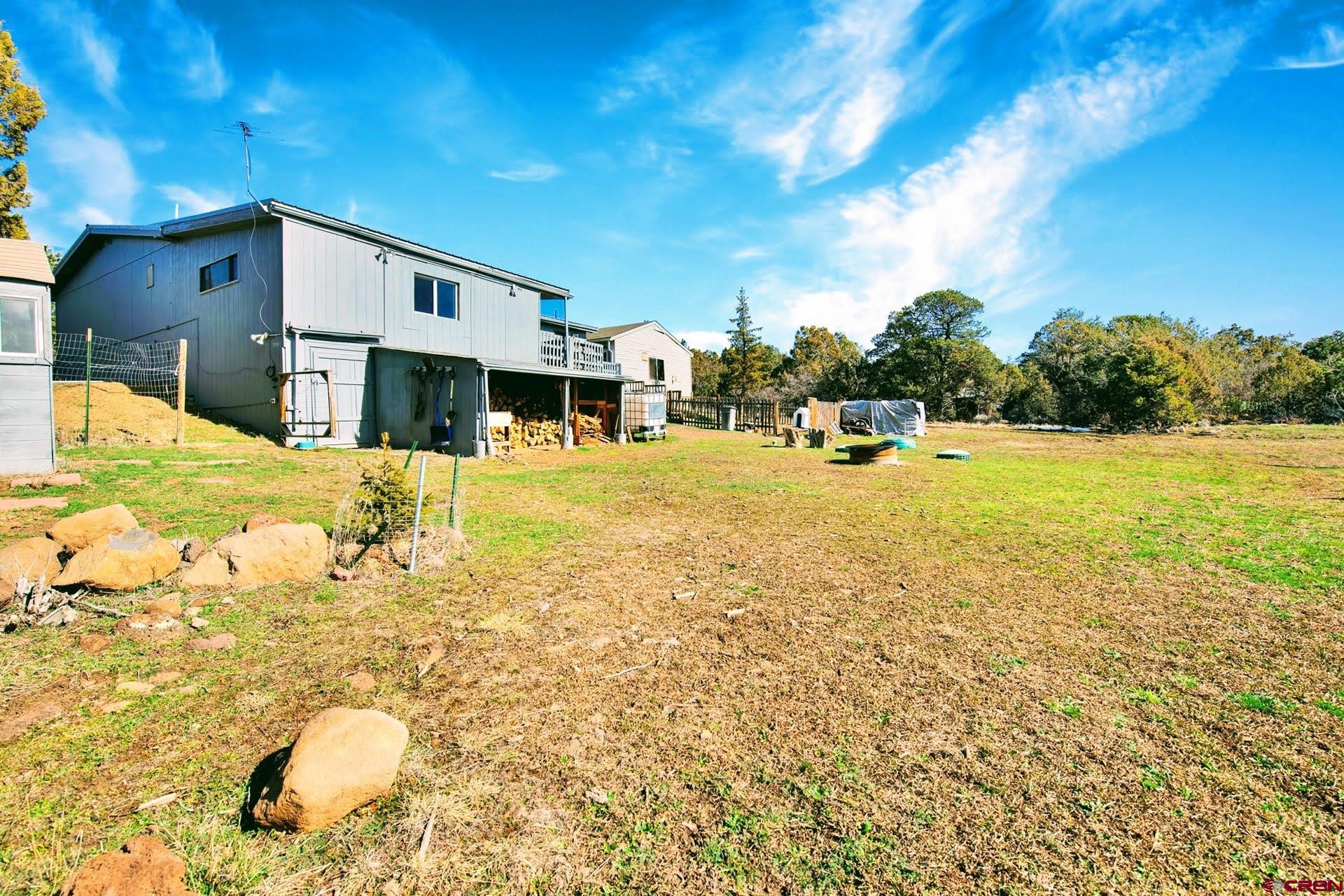 20984 Upland Road Cedaredge, CO 81413 - Photo 8 of 34 a view of a swimming pool with a patio