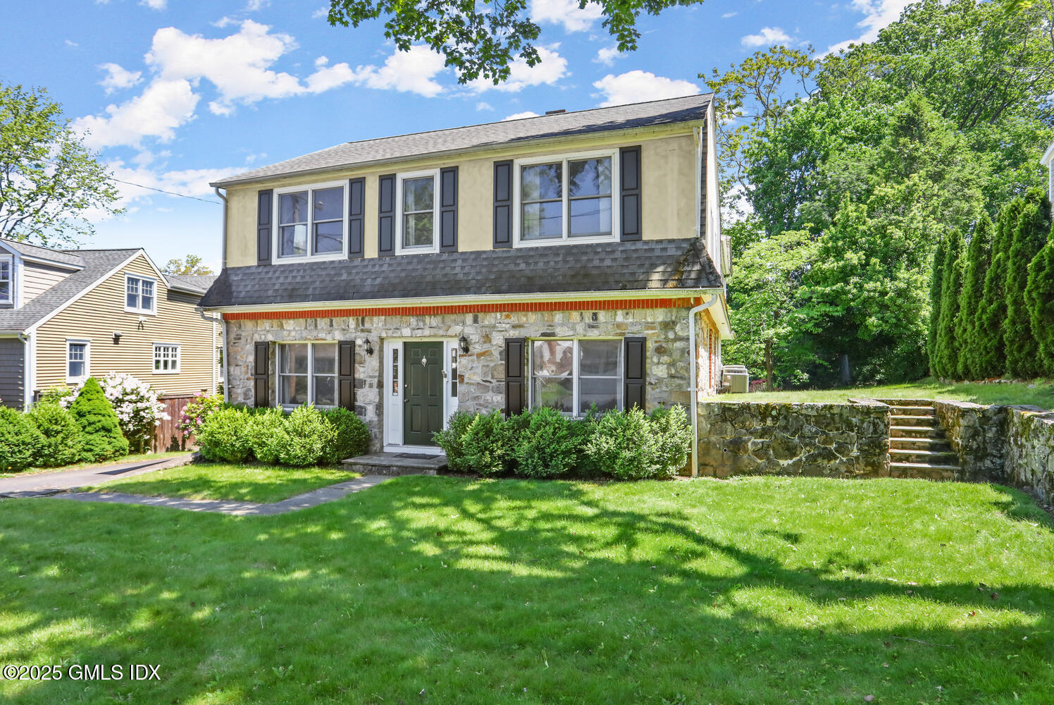 a front view of a house with a yard