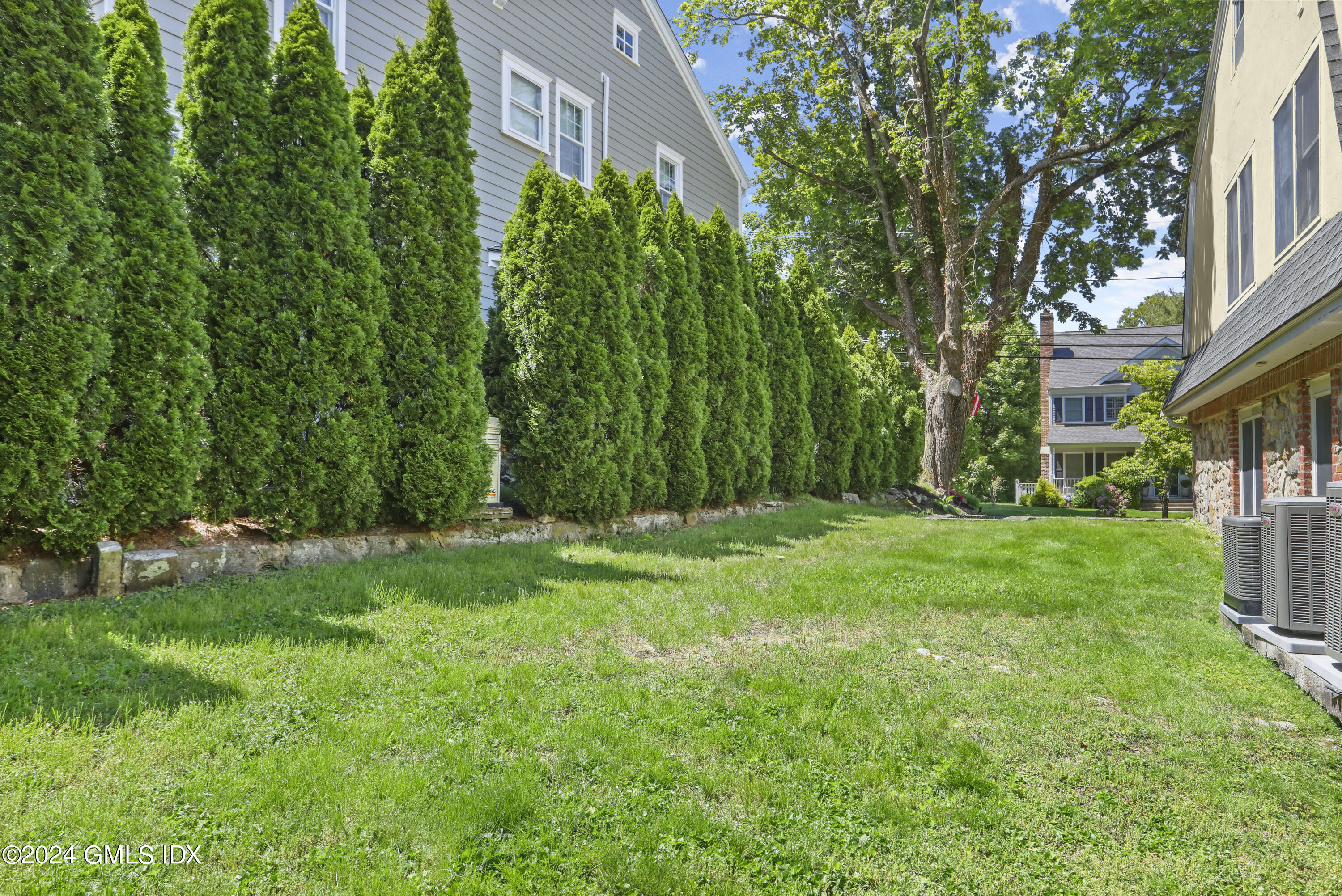 24 Sunshine Avenue Riverside, CT 06878 - Photo 19 of 20 a view of backyard with swimming pool and green space