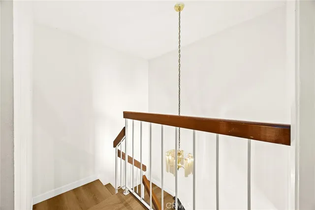 a view of staircase with rug