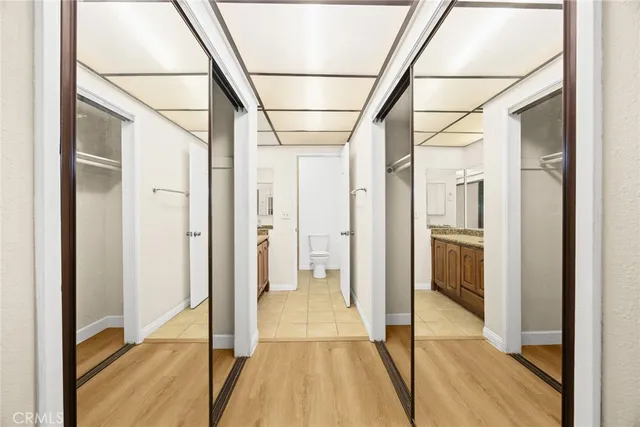 a spacious bathroom with a granite countertop sink a toilet and shower