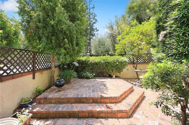 a view of a chairs and table in a backyard