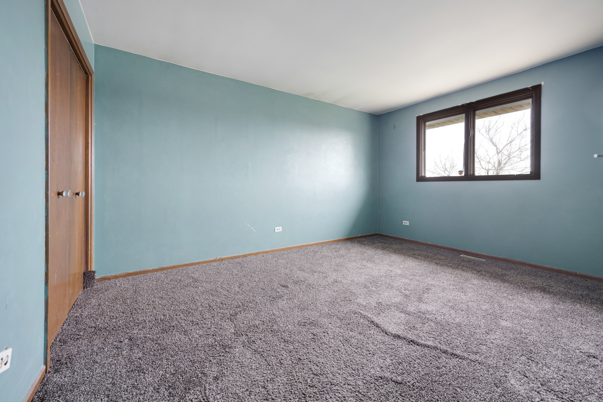 5916 West 127th Street Alsip, IL 60803 - Photo 16 of 22 an empty room with windows