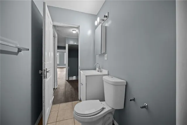 a bathroom with a toilet a sink and shower