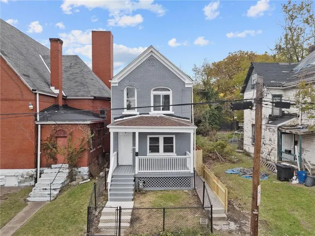a front view of a house with a porch