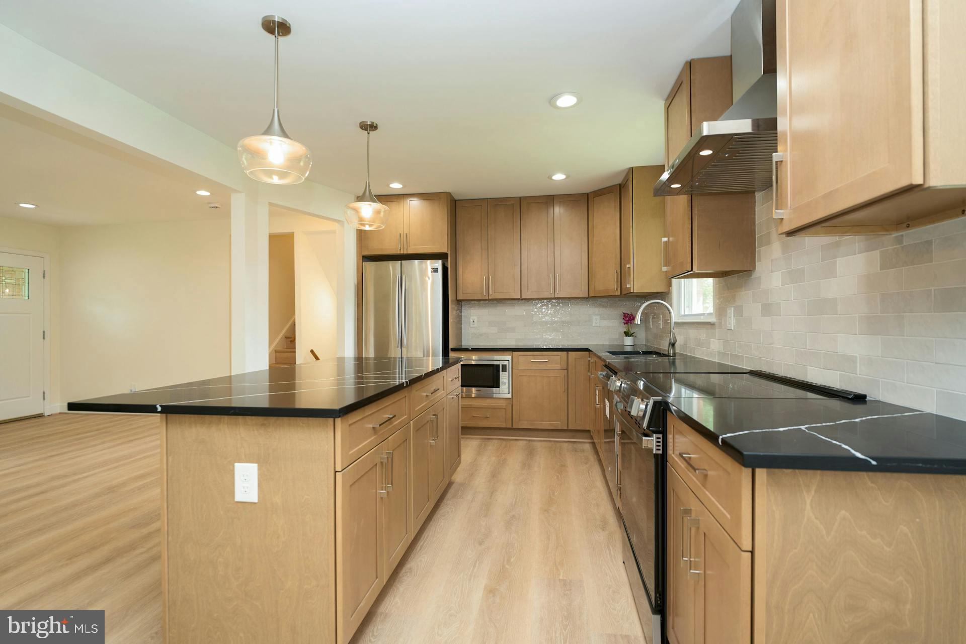 6710 Nicholson Road Falls Church, VA 22042 - Photo 7 of 36 New cabinets, counters, tile work, lights...
