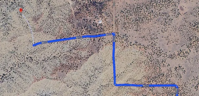 a street sign on a sidewalk next to a road