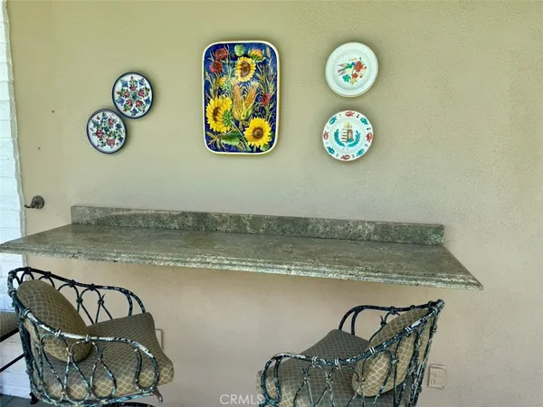 a view of dining table and two chairs
