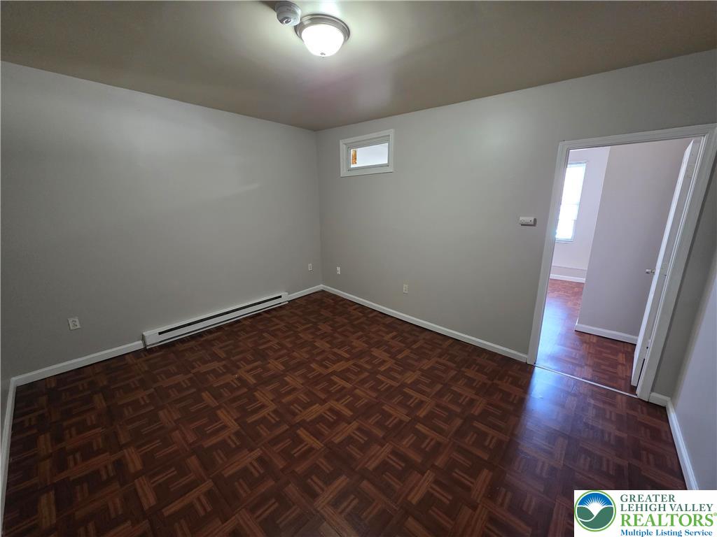 609 Walnut Street, Unit A Easton, PA 18042 - Photo 7 of 8 wooden floor in an empty room