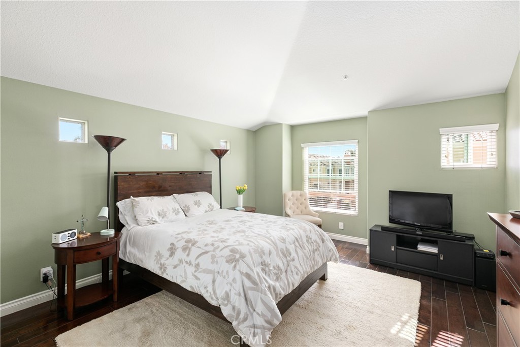 10 Crivelli Aisle Irvine, CA 92606 - Photo 14 of 28 Serene master bedroom with high ceilings and gorgeous wood flooring