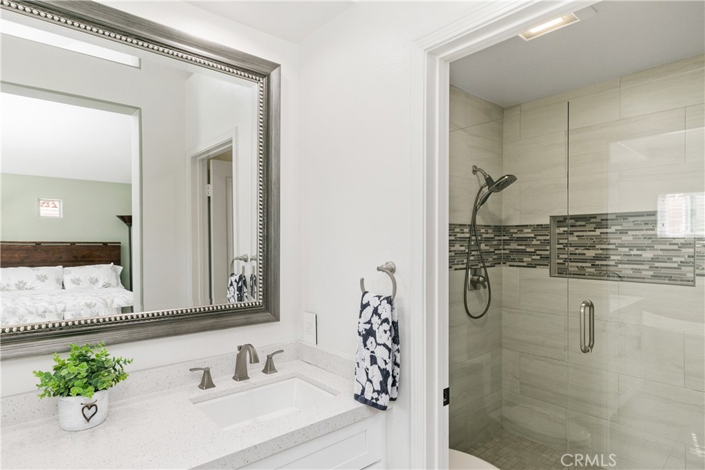 10 Crivelli Aisle Irvine, CA 92606 - Photo 17 of 28 Master bathroom separate shower with glass enclosure and floor to ceiling custom tile