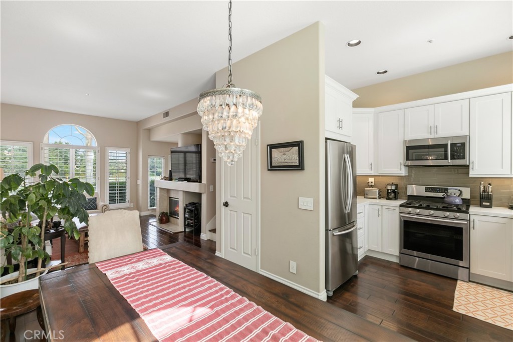 10 Crivelli Aisle Irvine, CA 92606 - Photo 7 of 28 Looking from dining area toward attached kitchen and living room