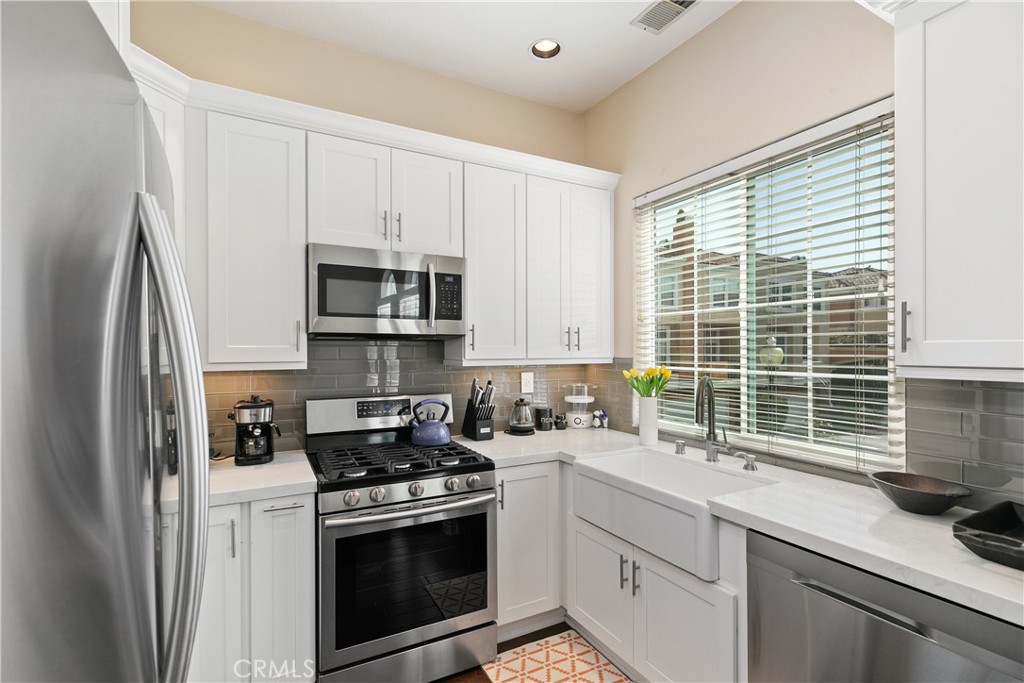 10 Crivelli Aisle Irvine, CA 92606 - Photo 8 of 28 Cooking is a joy in the beautifully remodeled kitchen