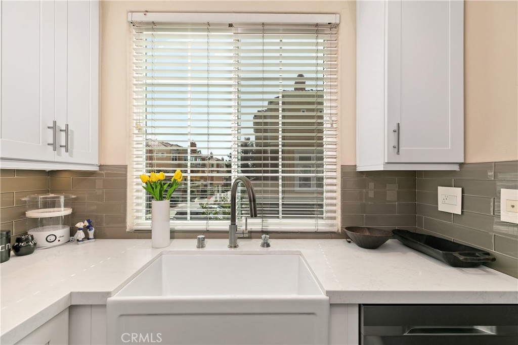 10 Crivelli Aisle Irvine, CA 92606 - Photo 9 of 28 Kitchen has farmhouse sink and stainless steel appliances