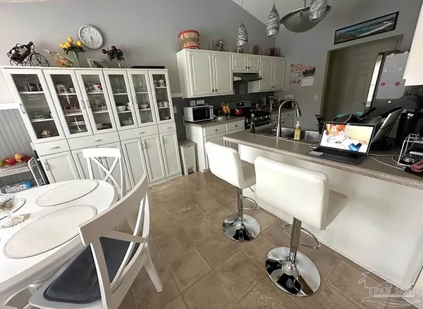 a view of living room with furniture and a fireplace