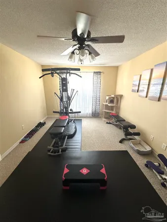 a room with gym equipment and a large window
