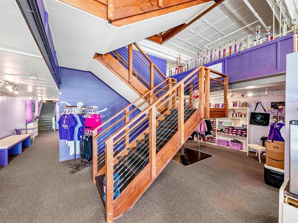 247 East Stuart Avenue Lake Wales, FL 33853 - Photo 4 of 19 a room with lots of white furniture and a chandelier